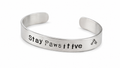 "Stay Pawsitive" hand-stamped Cuff